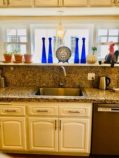 Bright kitchen area with decorative items and sink
