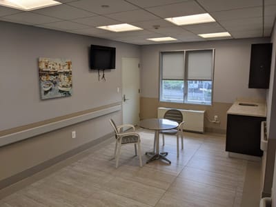 Bright, spacious common area with seating and artwork