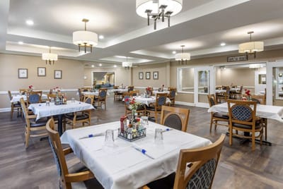 Bright dining room setup with tables and decor