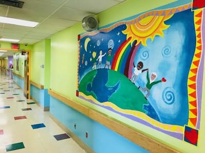 Colorful mural in a brightly lit hallway