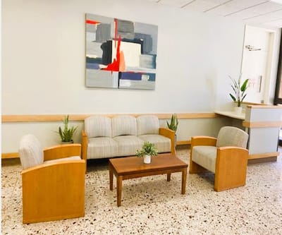 Bright common area with seating and artwork