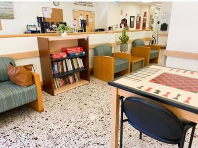 Interior common area with seating and bookshelves