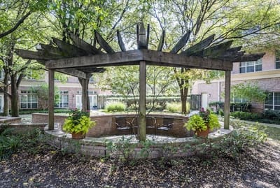 Outdoor seating area with a pergola and plants