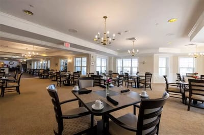 Interior of a dining room with tables and chairs