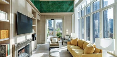 Bright common area with large windows and modern furnishings