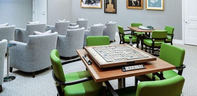 Cozy common area with Scrabble game and comfortable seating