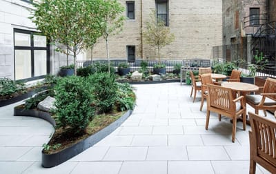 Patio area with seating and greenery