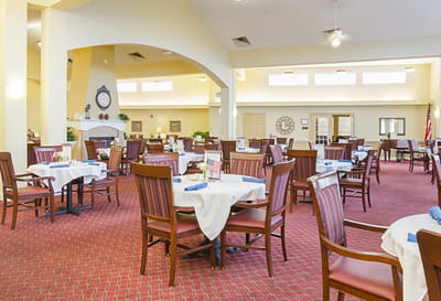 Dining area with tables and chairs in a bright space