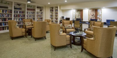 Common area with comfortable seating and bookshelves