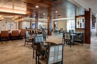 Dining area with modern furnishings and bright lighting