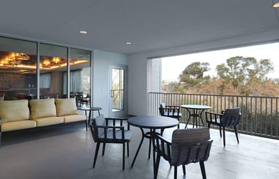 Outdoor seating area with tables and chairs