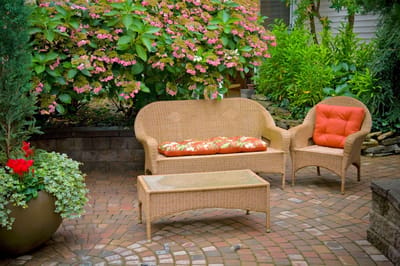 Cozy outdoor seating area surrounded by lush greenery