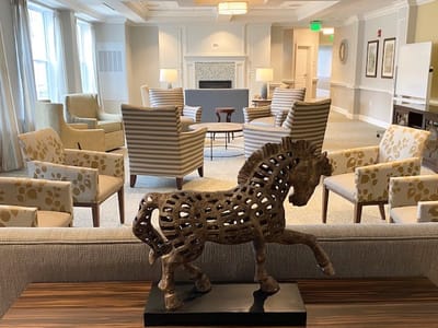 Interior common area with seating and decorative sculpture