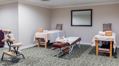 Interior of a spa treatment room with massage tables