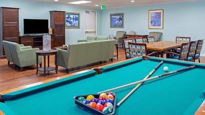Interior common area with seating and a pool table