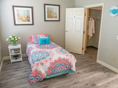 Cozy resident room with colorful decor and natural light