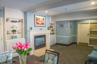 Bright common area with a decorative fireplace