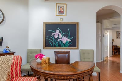Interior view of a dining area with table and artwork