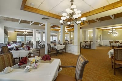 Dining area with tables set for residents