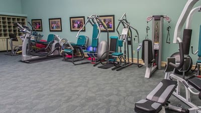 Well-equipped fitness room with exercise machines