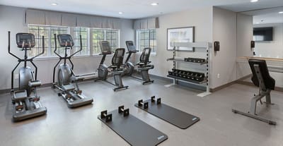Interior view of a modern fitness room with exercise equipment