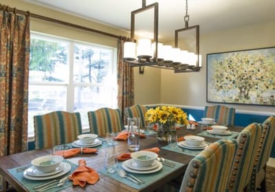 Dining area set up for a meal with flowers