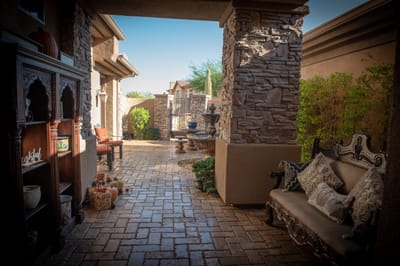 A serene outdoor pathway with seating and landscaping
