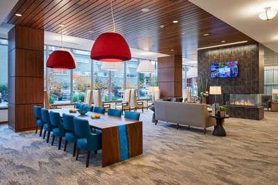 Bright common area with seating and dining table