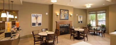 Cozy dining area with tables and artwork