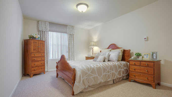 A well-furnished private bedroom at the facility
