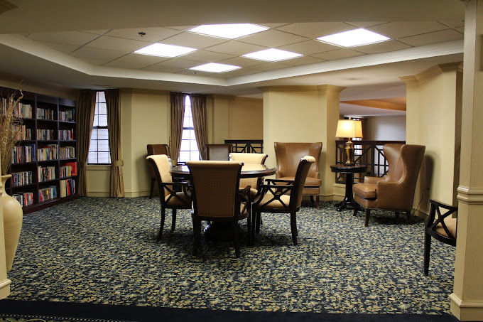Bright common area with seating and bookshelves