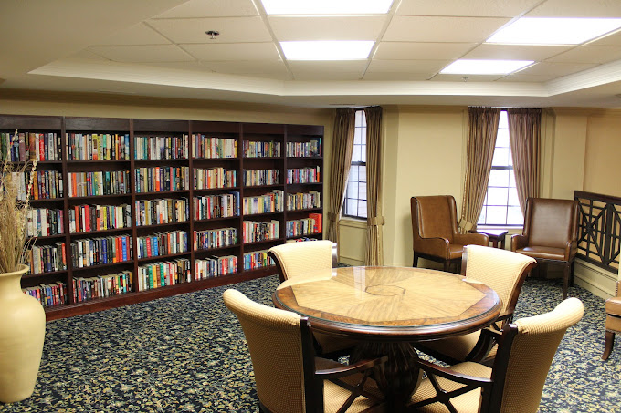 Cozy reading area with bookshelves and seating