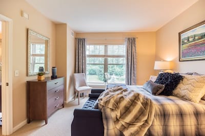 A well-decorated private resident bedroom with a view