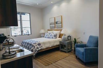 Cozy private resident room with bed and seating