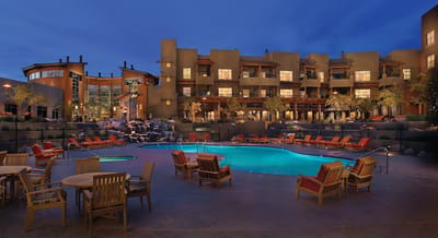 Exterior view of a senior living facility with pool area