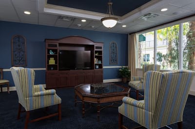 Bright common area with seating and TV
