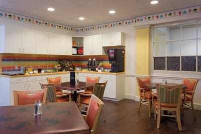 Bright dining area with tables and food service station
