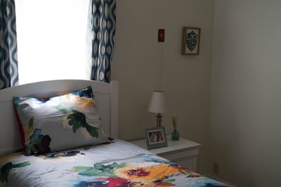Cozy resident room with floral bedding