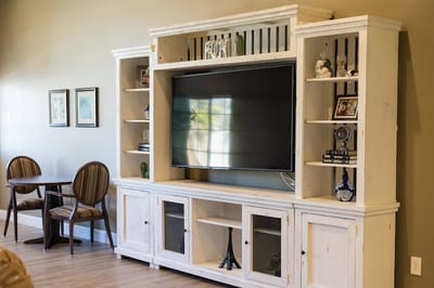 Contemporary interior shelving with a TV in a lounge area