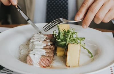 Close-up of a plated meal being served