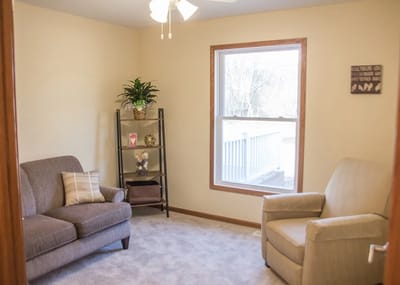 Comfortable interior sitting area with light decor.