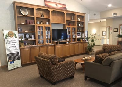 Common area with seating and entertainment center.