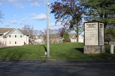 Exterior view of Evergreen Woods facility sign and buildings