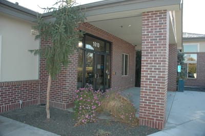 Building entrance with landscaping and signage
