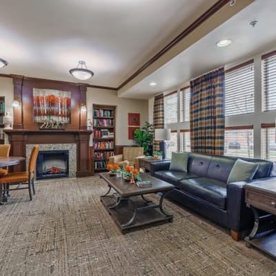 Cozy common area with seating and bookshelves