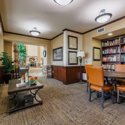 Common area with seating and a bookshelf