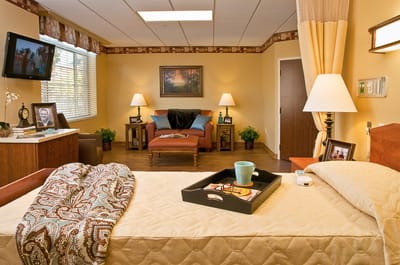 Cozy resident room with a bed and seating area