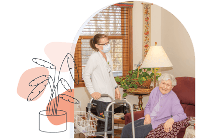 Staff assisting resident in a cozy common area