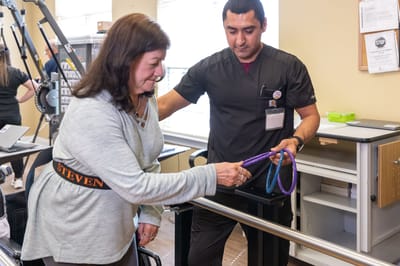 A resident engaging in therapy with a staff member