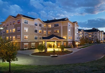 Exterior view of the assisted living facility at dusk
